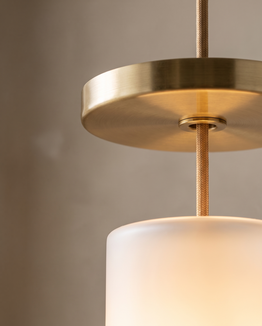 Brass canopy and opal glass pendant detail