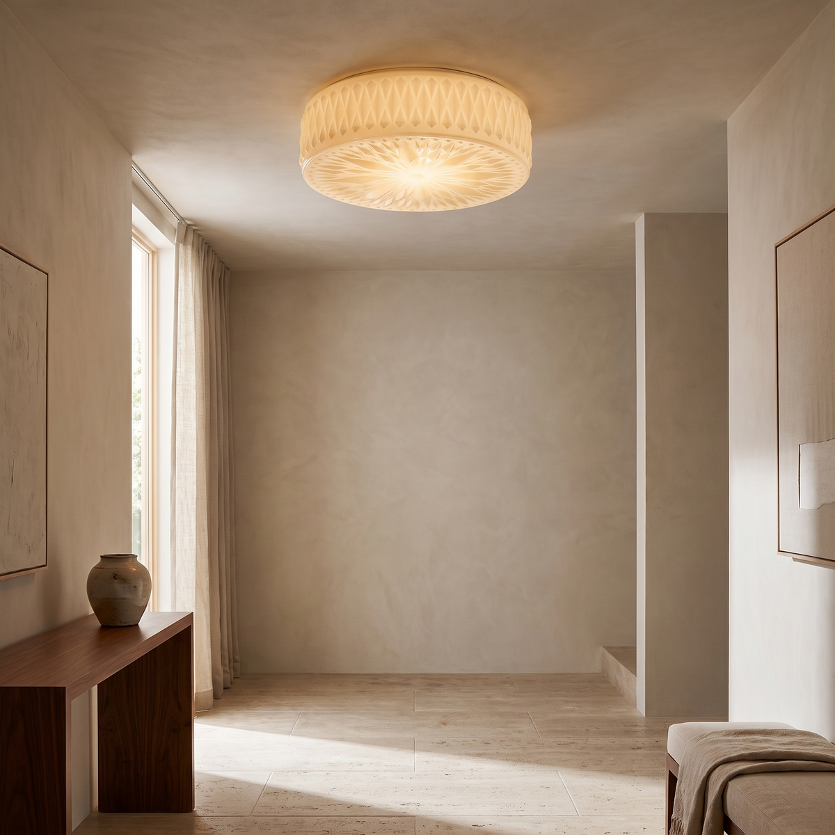 Adler Ceiling Light, a frosted glass flush-mount fixture with diamond-cut texture, installed above a console table in a contemporary entryway.