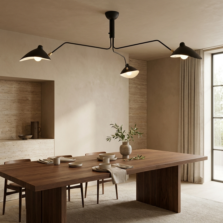 Multi-Arm Spider Ceiling Light in Black (3-Head), a sculptural three-arm ceiling lamp installed above a walnut dining table in a contemporary interior.