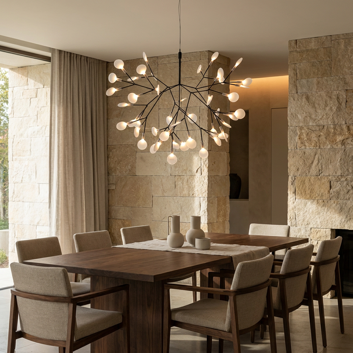 Black Firefly LED Chandelier installed above a dining table