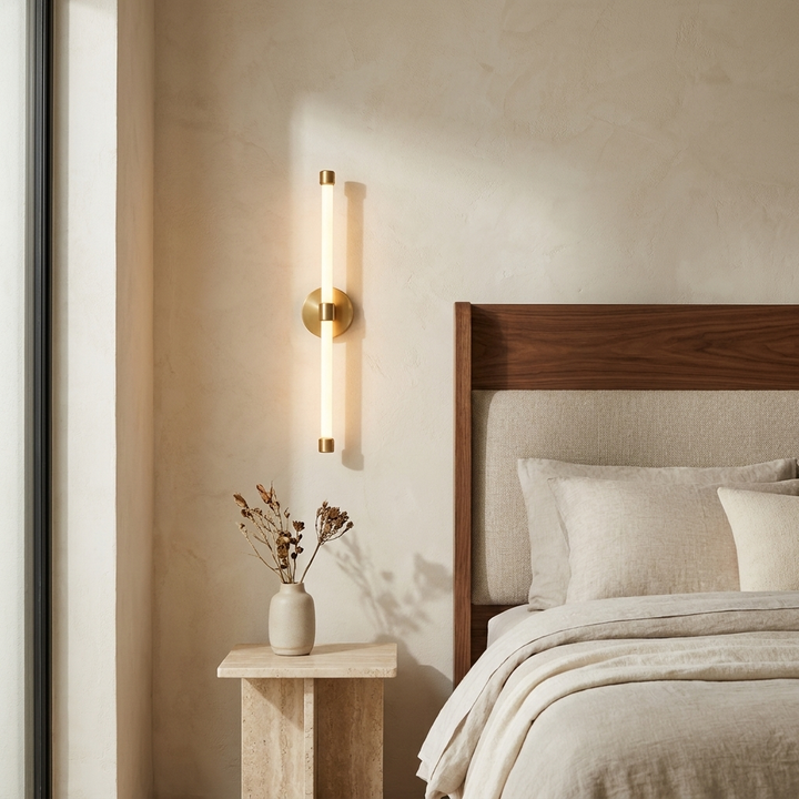 Brilline Vertical Sconce installed beside a bed in a contemporary bedroom