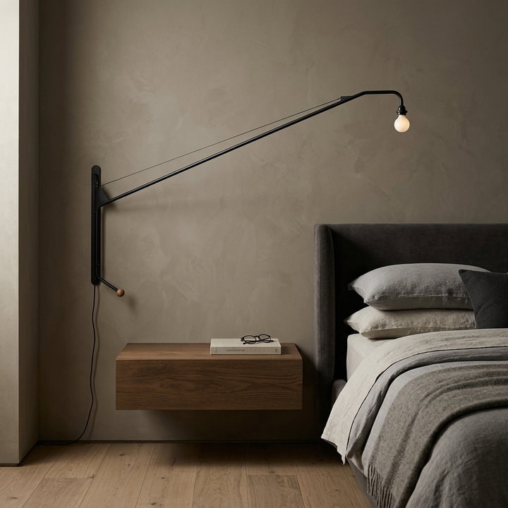 Black Long Arm Wall Lamp installed beside a bed in a contemporary bedroom