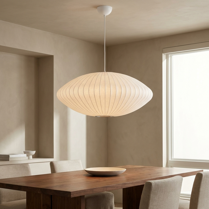 NYRVEQO Crisscross Bubble Pendant Light in a saucer shade profile, hanging above a dining table
