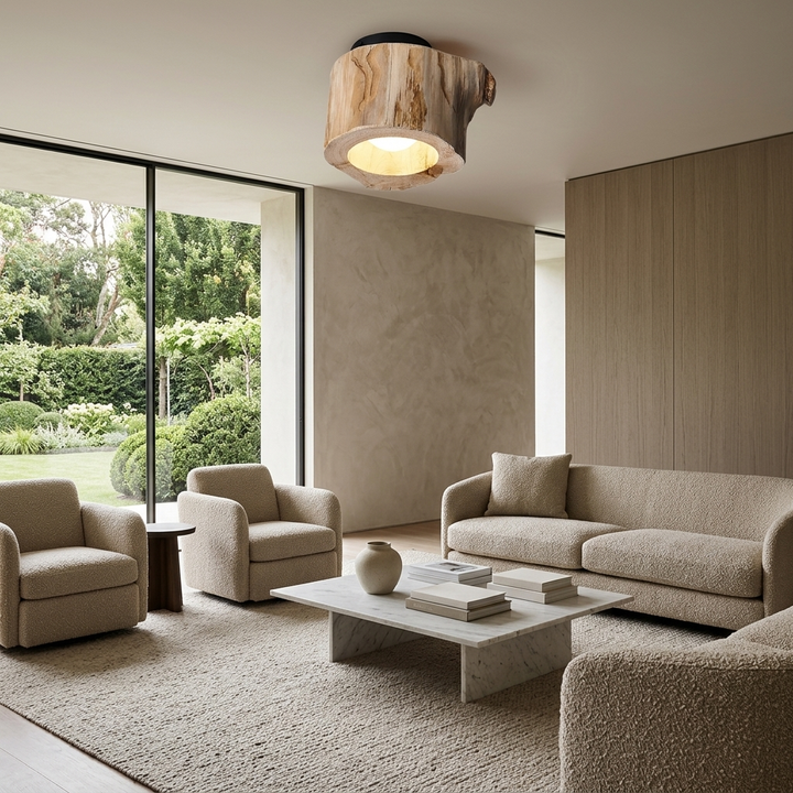 Tarn Hollow Ceiling Lamp mounted on a living room ceiling, hollowed wood center glowing warm