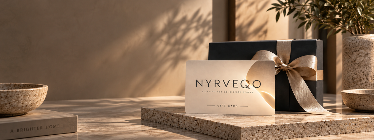 NYRVEQO Gift Card and gift box on a marble surface in a warm architectural interior