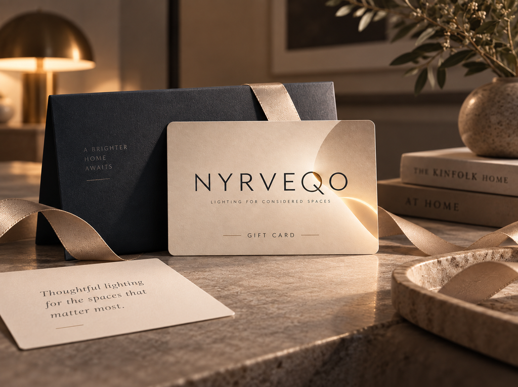 NYRVEQO Gift Card presented with a black gift box and gold ribbon on a marble surface